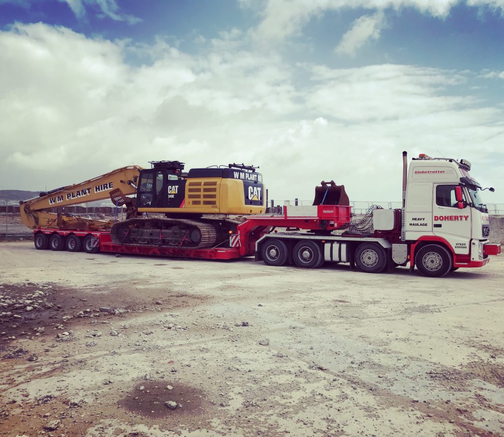 CAT construction machinery loaded onto Doherty Low Loader for Transport