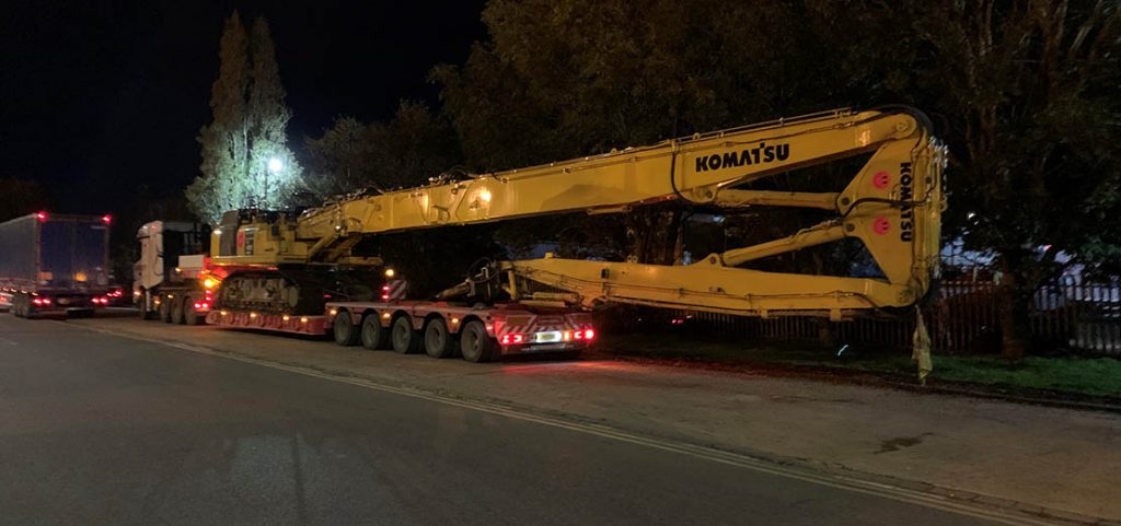 Low Loader ready to transport Komatsu large crane night time