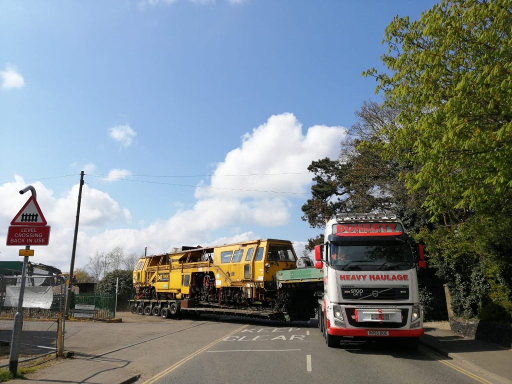 Yellow Rail Train Carriage On Its Way To A UK Destination